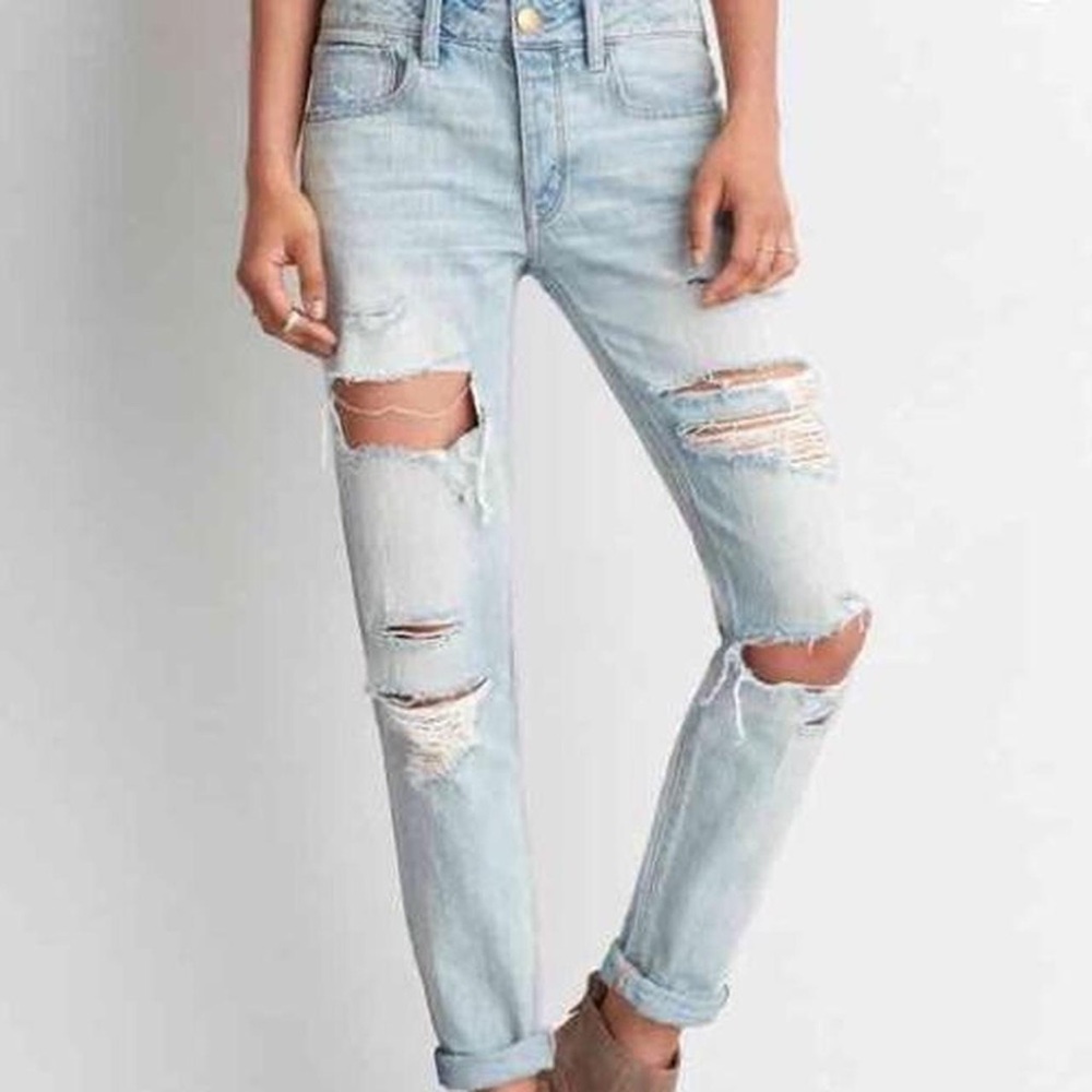 heavily distressed american eagle tomgirl mom jeans
